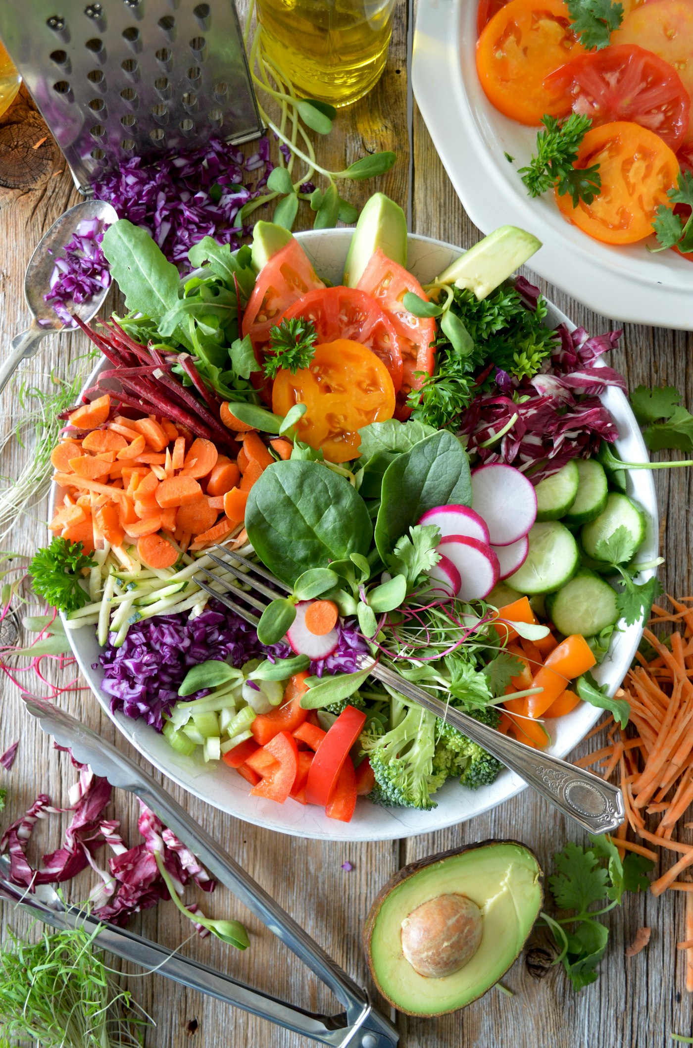 A bowl of roasted vegetables and greens