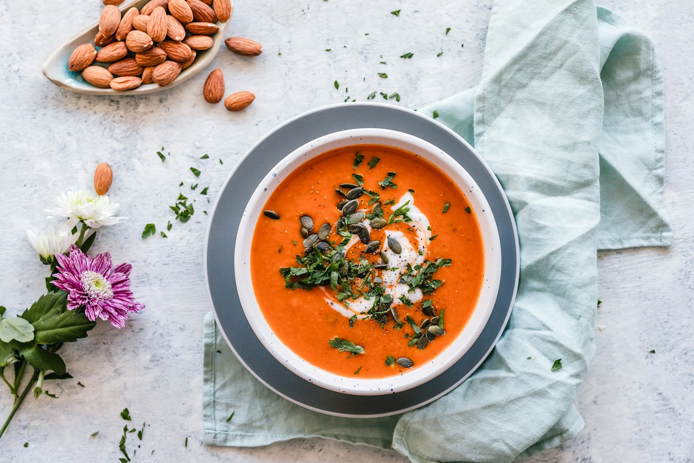 A bowl of vegetable soup with herbs